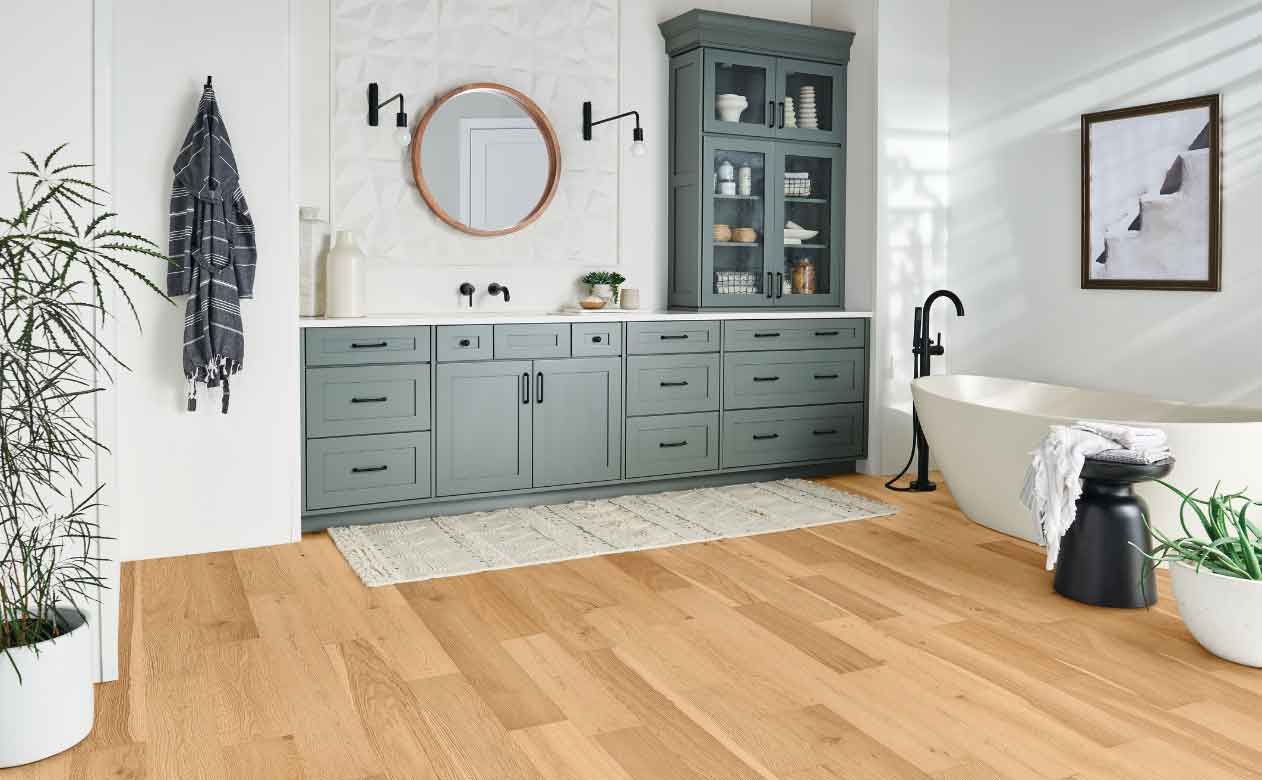 light white oak engineered hardwood in contemporary bathroom with blue accent vanity